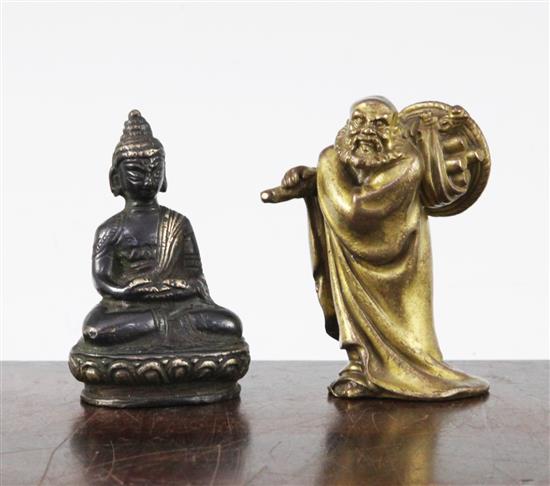 A Chinese gilt bronze figure of a sage and a South East Asian bronze figure of a Buddha, 19th century, 8cm